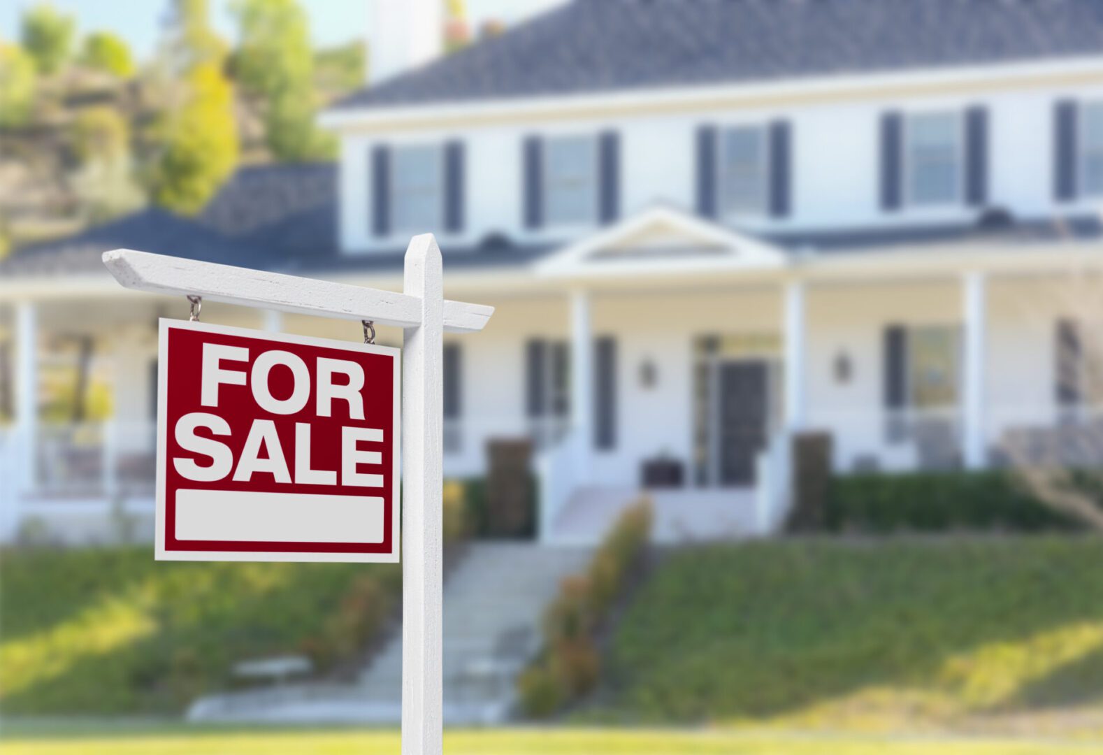 Home For Sale Real Estate Sign in Front of Beautiful New House. Livable Canada