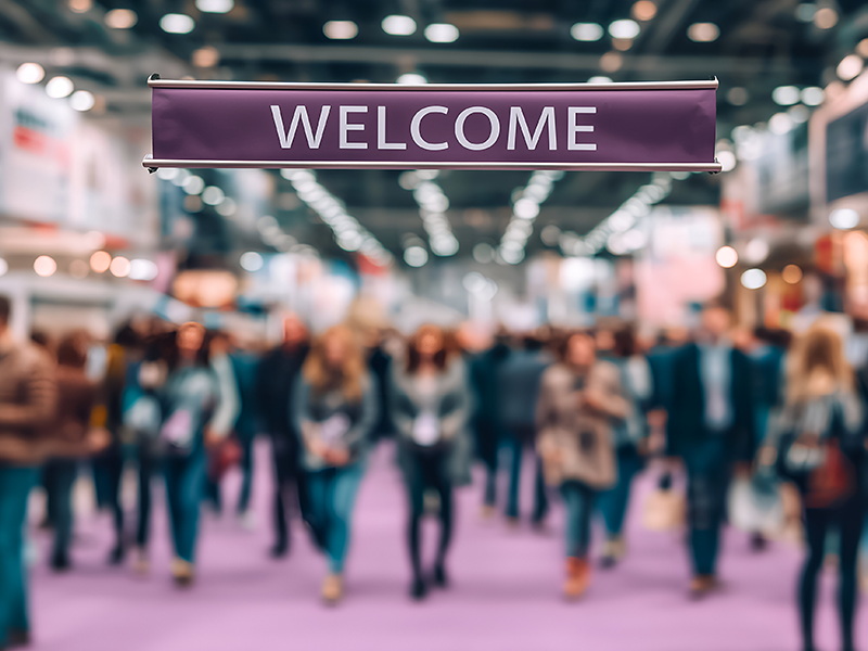 Purple welcome banner at trade show entrance